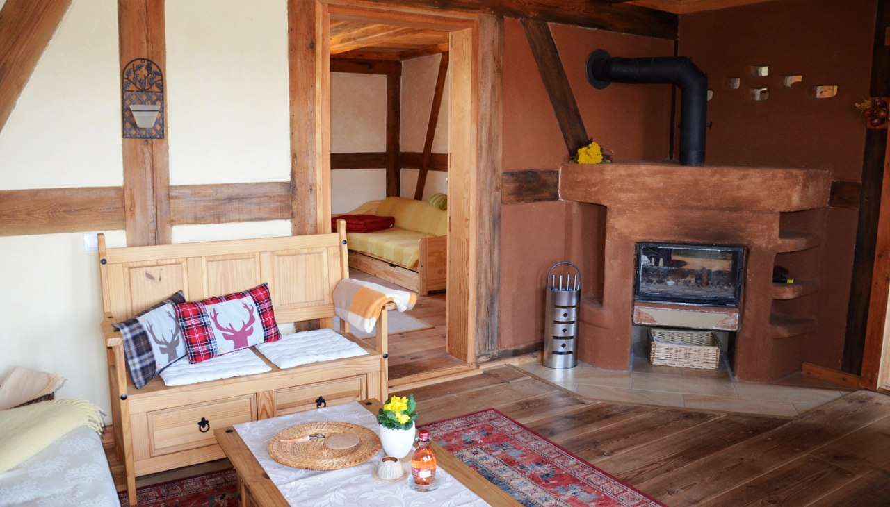 Woonkamer in de vakantiewoning vakwerkhuis bovenverdieping, © Kurverwaltung FSL Woonkamer in de vakantiewoning vakwerkhuis bovenverdieping, © Kurverwaltung FSL