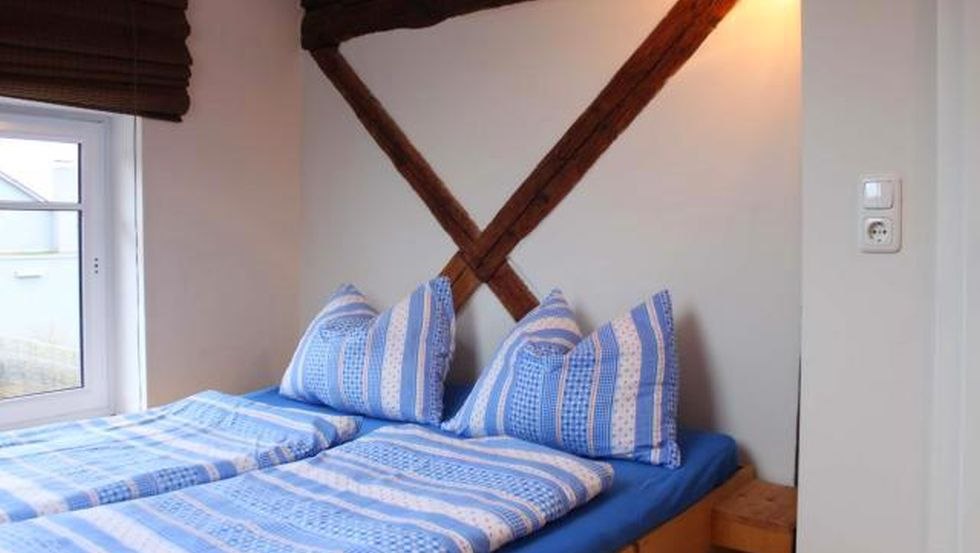Schlafzimmer im Haus Nele // © MITourA GmbH Schlafzimmer im Haus Nele // © MITourA GmbH