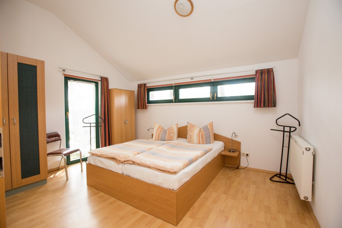 Slaapkamer in het vakantiehuis Waldschneise // © Ferienkontor Slaapkamer in het vakantiehuis Waldschneise // © Ferienkontor