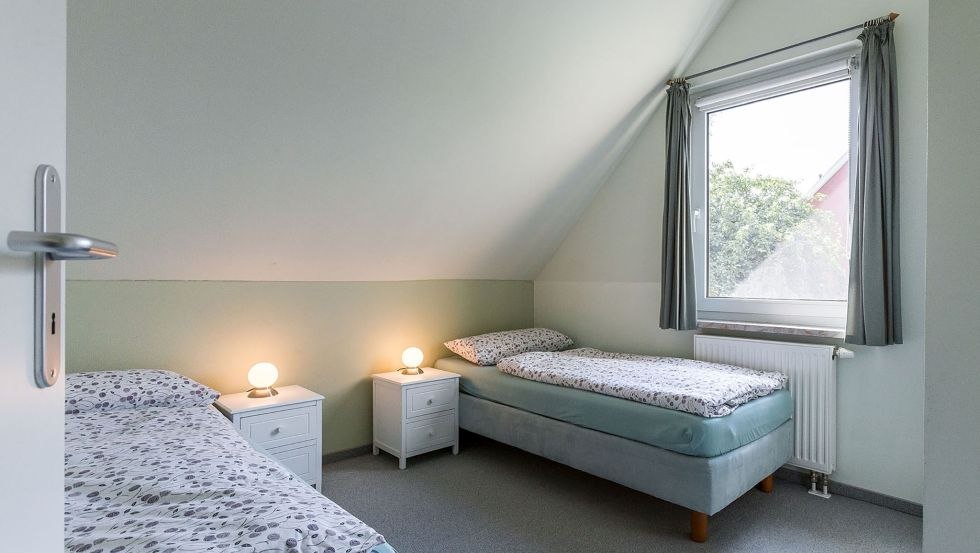 Schlafzimmer mit Einzelbetten // © Andre Pretzel Schlafzimmer mit Einzelbetten // © Andre Pretzel