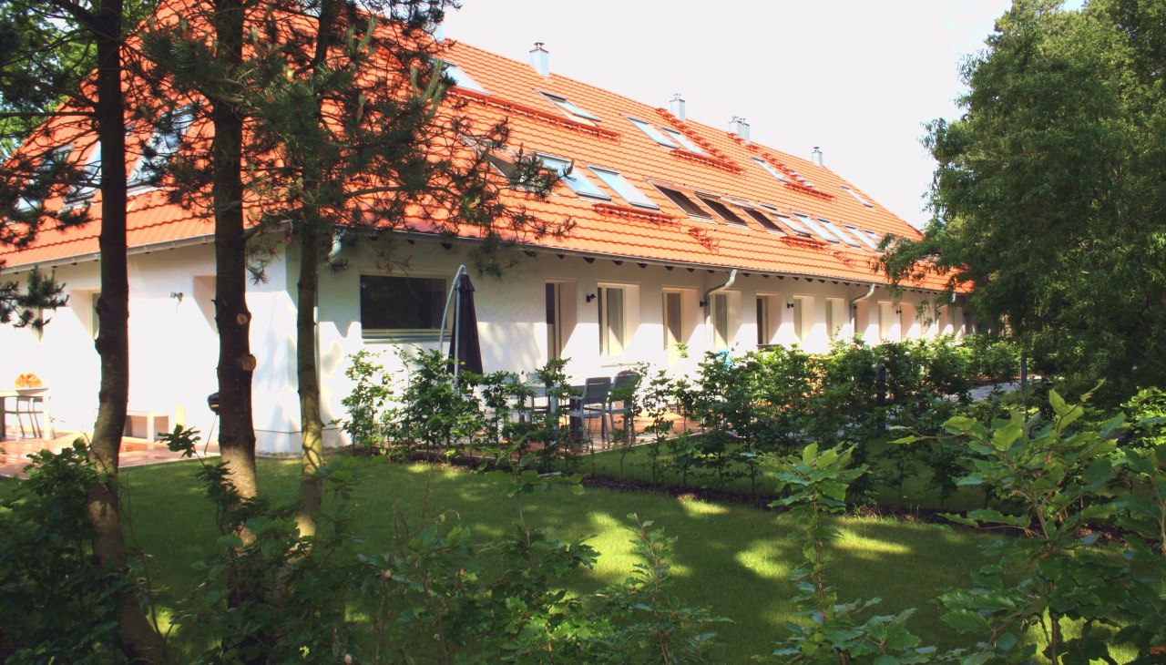 Haus Düne31 ApartmenthausAußenansicht mit Garten und Terrassen, © Haus Düne31 Haus Düne31 ApartmenthausAußenansicht mit Garten und Terrassen, © Haus Düne31