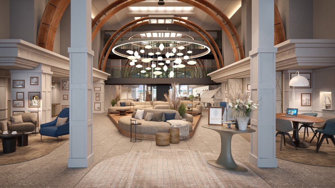 De centrale loungeruimte brengt de omringende natuur naar de lobby met zijn zandkleurige meubilair, oceaanblauwe contrasten en ruimtelijkheid. // © Mein Rügen Betriebsgesellschaft mbH De centrale loungeruimte brengt de omringende natuur naar de lobby met zijn zandkleurige meubilair, oceaanblauwe contrasten en ruimtelijkheid. // © Mein Rügen Betriebsgesellschaft mbH