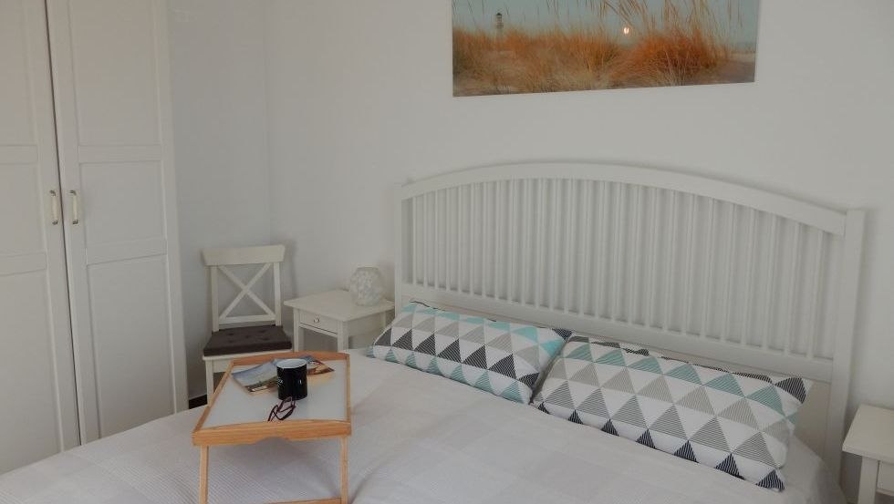 Gemütliches Schlafzimmer im Ferienhaus Familienzeit // © @cramer Gemütliches Schlafzimmer im Ferienhaus Familienzeit // © @cramer